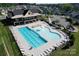 Community pool features a lap pool, zero-entry pool, mushroom fountain, and ample seating for relaxation and recreation at 2097 Saddlebred Dr, Iron Station, NC 28080