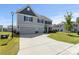 Charming two-story home featuring a spacious driveway and a well-maintained front lawn at 2097 Saddlebred Dr, Iron Station, NC 28080