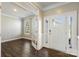 Bright foyer with hardwood floors, glass-paneled doors and an office space at 2097 Saddlebred Dr, Iron Station, NC 28080