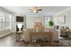 Comfortable living room featuring a fireplace, large windows, and stylish decor at 2097 Saddlebred Dr, Iron Station, NC 28080