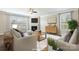 Cozy living room featuring a fireplace, large windows, and comfortable seating at 2097 Saddlebred Dr, Iron Station, NC 28080
