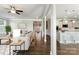 Open-concept living room featuring hardwood floors, a neutral color palette, and seamless flow to kitchen at 2097 Saddlebred Dr, Iron Station, NC 28080
