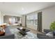Comfortable living room with stylish furnishings and an open view into the main bedroom, filled with natural light at 2097 Saddlebred Dr, Iron Station, NC 28080