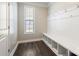 Mudroom featuring built-in bench with cubbies, hooks and a window, perfect for organization at 2097 Saddlebred Dr, Iron Station, NC 28080