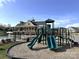 Fun playground with slides, climbing structures, and a soft landing surface, set against the backdrop of the clubhouse at 2097 Saddlebred Dr, Iron Station, NC 28080