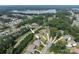 This aerial view shows the community, house, and nearby Mountain Island Lake at 221 N Centurion Ln, Mount Holly, NC 28120