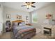 Charming bedroom with a cozy bed, decorative pillows, and a vanity area with a stool at 221 N Centurion Ln, Mount Holly, NC 28120
