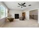 Spacious bonus room with a ceiling fan and comfortable seating at 221 N Centurion Ln, Mount Holly, NC 28120