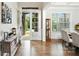 Bright foyer with hardwood floors, showcasing the entryway and adjacent dining area at 221 N Centurion Ln, Mount Holly, NC 28120