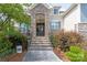 Elegant front door with stone archway, and decorative wreaths, offering a warm welcome at 221 N Centurion Ln, Mount Holly, NC 28120