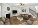Comfortable living room with hardwood floors, fireplace, and staircase at 221 N Centurion Ln, Mount Holly, NC 28120