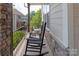 Inviting porch with comfortable rocking chairs, perfect for relaxing outdoors at 221 N Centurion Ln, Mount Holly, NC 28120