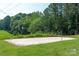 Sand volleyball court with lush green surroundings, promoting active and outdoor community engagement at 221 N Centurion Ln, Mount Holly, NC 28120