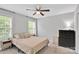 Well-lit bedroom featuring a ceiling fan, carpeted floor, and a neutral color scheme at 2662 14Th Ne St, Hickory, NC 28601