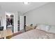 Bedroom featuring a minimalist design, closet, and neutral color palette with plush bedding at 2662 14Th Ne St, Hickory, NC 28601