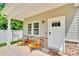 Inviting front porch with stone accents and a cozy seating area at 2662 14Th Ne St, Hickory, NC 28601