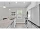 Bright kitchen featuring stainless steel appliances, granite countertops, and plentiful natural light at 2662 14Th Ne St, Hickory, NC 28601