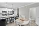 Open kitchen with white cabinetry, granite countertops, and a dining area at 2662 14Th Ne St, Hickory, NC 28601