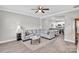 Open-concept living room featuring a large sectional sofa and hardwood flooring at 2662 14Th Ne St, Hickory, NC 28601