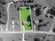 Aerial view of the property showing the lot lines with the house and surrounding landscaped yard in full color at 2694 Rock Dam Rd, Lincolnton, NC 28092