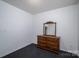 Bedroom featuring carpeted floors and a dresser with a mirror at 2694 Rock Dam Rd, Lincolnton, NC 28092
