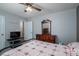 Comfortable bedroom featuring a dresser, soft lighting, and neutral wall color at 2694 Rock Dam Rd, Lincolnton, NC 28092