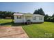 Lovely single-story home boasting a well-maintained lawn, cozy porch, and ample natural light at 2694 Rock Dam Rd, Lincolnton, NC 28092