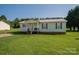 Delightful single-story home featuring a cozy front porch and lush green lawn for curb appeal at 2694 Rock Dam Rd, Lincolnton, NC 28092