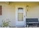 Close-up of a cozy front porch with a bench and plants, creating a welcoming entrance at 2694 Rock Dam Rd, Lincolnton, NC 28092