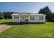 Charming single-story home with a well-maintained lawn and inviting front porch at 2694 Rock Dam Rd, Lincolnton, NC 28092