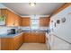 Functional kitchen with wooden cabinets, practical appliances, and a bright window at 2694 Rock Dam Rd, Lincolnton, NC 28092