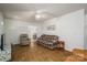 Inviting living room with a view into the kitchen and classic furnishings at 2694 Rock Dam Rd, Lincolnton, NC 28092
