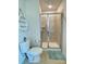 Modern bathroom with a glass-enclosed shower, toilet, and decorative shelving at 2769 Sawbridge Ln, Gastonia, NC 28056