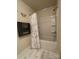 Bathroom showing shower-tub combo with white tile surround and patterned shower curtain at 2769 Sawbridge Ln, Gastonia, NC 28056