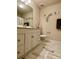 Bright bathroom featuring white cabinets, butterfly decor, and a tiled floor at 2769 Sawbridge Ln, Gastonia, NC 28056