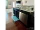 Kitchen island with granite countertops, stainless steel appliances, and hardwood floors at 2769 Sawbridge Ln, Gastonia, NC 28056