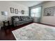 Comfortable living room with a plush sofa, decorative rug, and ample natural light at 2769 Sawbridge Ln, Gastonia, NC 28056
