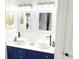 Stylish bathroom featuring double vessel sinks and quartz countertop with cobalt blue cabinetry at 3114 Luke Crossing Dr, Charlotte, NC 28226
