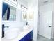Modern bathroom showcasing dual vessel sinks, cobalt blue vanities, and elegant decor at 3114 Luke Crossing Dr, Charlotte, NC 28226