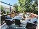 Outdoor living space featuring patio seating, fire pit table and wooded views for serene relaxation at 3114 Luke Crossing Dr, Charlotte, NC 28226