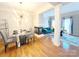 Stylish dining room with a glass table, modern lighting, and easy access to the living space at 3114 Luke Crossing Dr, Charlotte, NC 28226