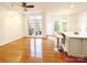 Bright kitchen area featuring hardwood floors, ample natural light, and a breakfast bar at 3114 Luke Crossing Dr, Charlotte, NC 28226