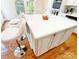 Close up of kitchen island with white countertop, storage, and two barstools at 3114 Luke Crossing Dr, Charlotte, NC 28226