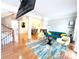 Open-concept living room features hardwood floors, stylish furnishings, and a fireplace at 3114 Luke Crossing Dr, Charlotte, NC 28226