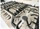 Stainless steel gas cooktop stove with black grates and stainless steel knobs at 3114 Luke Crossing Dr, Charlotte, NC 28226