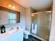 Bathroom featuring a shower, a mirror over the sink, a toilet, and hardwood floors at 4754 Old Lantern Way, Charlotte, NC 28212