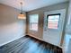 Cozy breakfast nook featuring wood floors, a door to the backyard, and natural light at 4754 Old Lantern Way, Charlotte, NC 28212