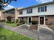 Street view of well-maintained townhomes with brick facades, neat landscaping, and inviting walkways at 4754 Old Lantern Way, Charlotte, NC 28212