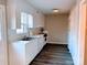 Bright kitchen with white cabinets, wood floors, and modern appliances at 4754 Old Lantern Way, Charlotte, NC 28212