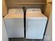 The laundry room has a white washing machine and dryer side-by-side at 4754 Old Lantern Way, Charlotte, NC 28212